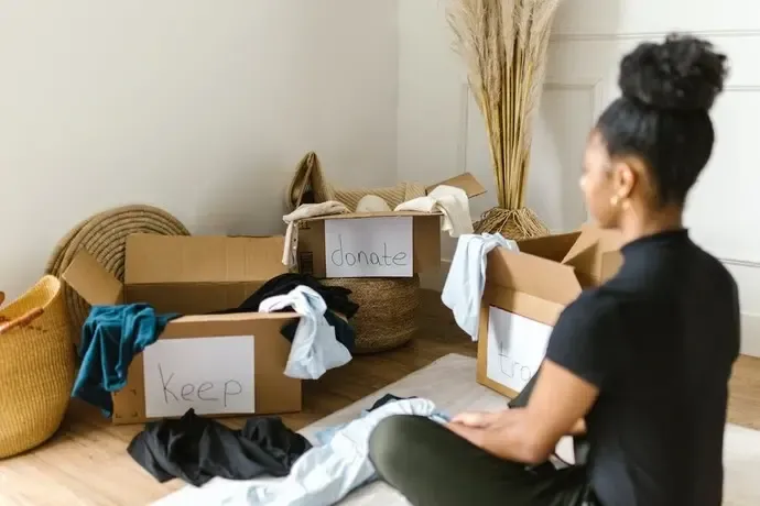 woman decluttering and packing