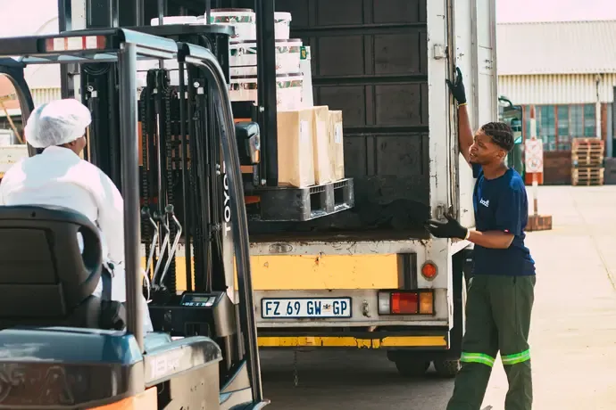 Truck driver loading truck