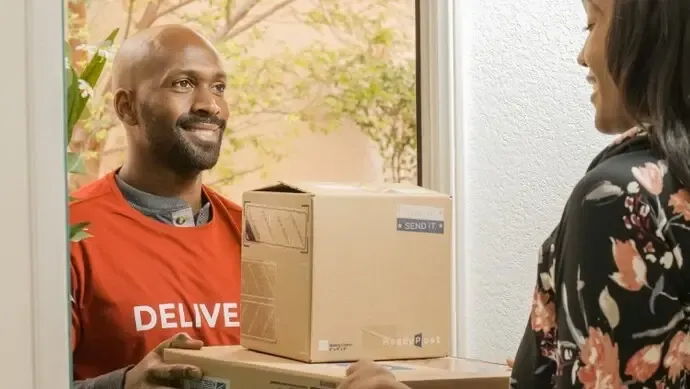 Delivery guy handing parcel