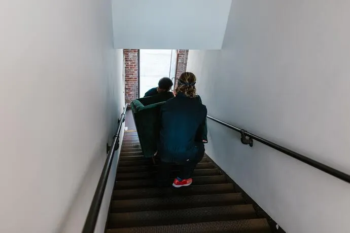 2 people carrying Sofa
