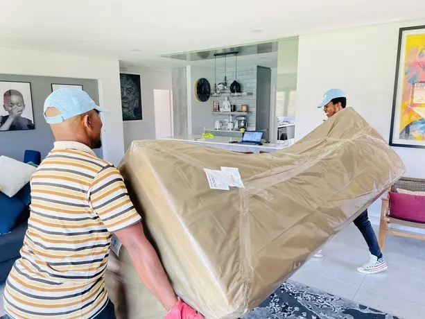 Men Moving couch within house