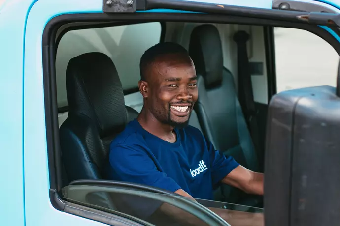 Driver smiling from behind the wheel