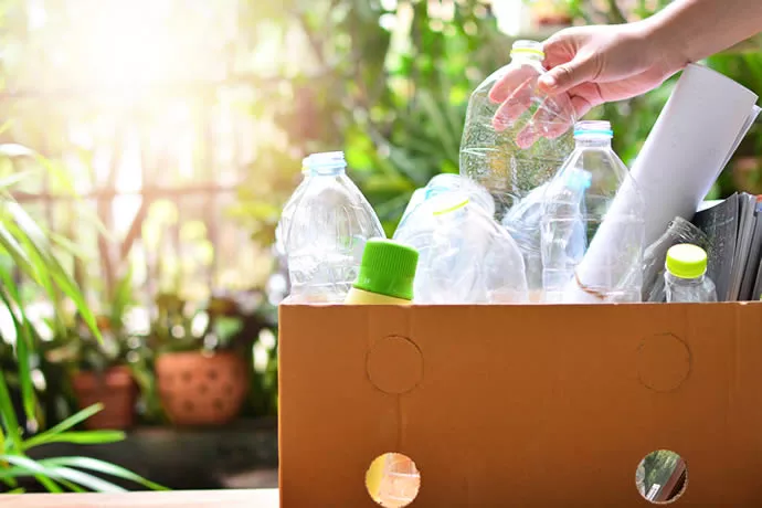 Box full of plastic bottles for recycling