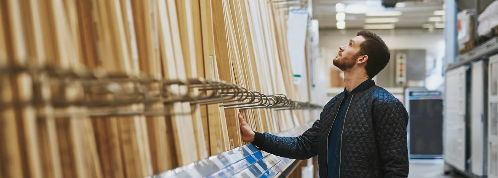 A customer browsing pieces of wooden slats